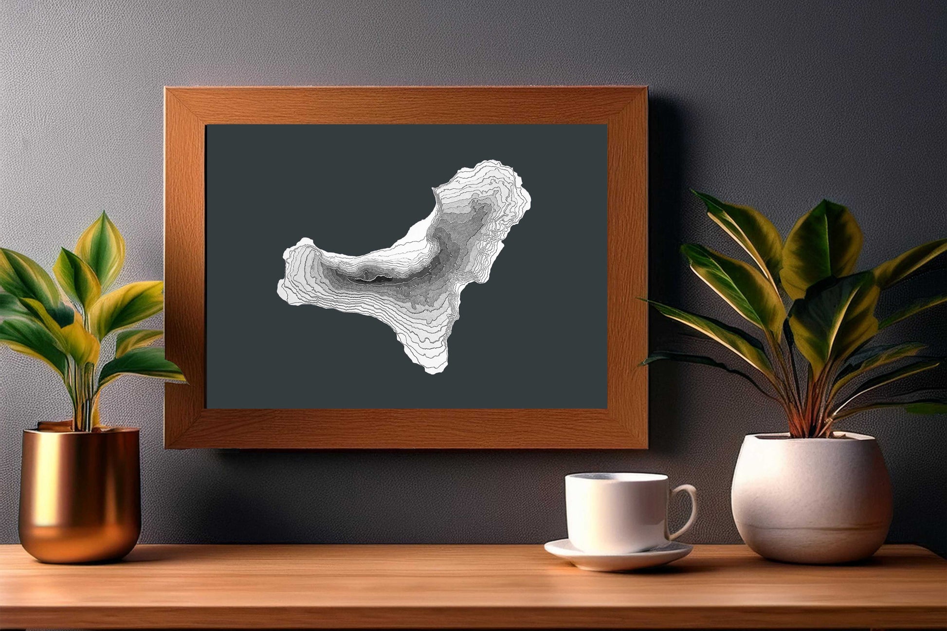 The 3D raised relief map of El Hierro island belonging to the Canary Islands archipelago is made of layered cardstock. In this image, the map is displayed in a wooden frame. It will look awesome in any kind of interior style.