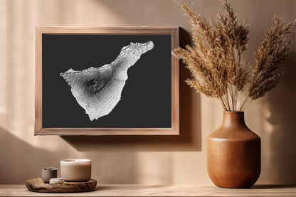 The 3D textured raised relief map of Tenerife is displayed in a wooden frame. Although the map is sold unframed, it will look great in different coloured frames thanks to its grayscale colour palette and will also fit most home decors.